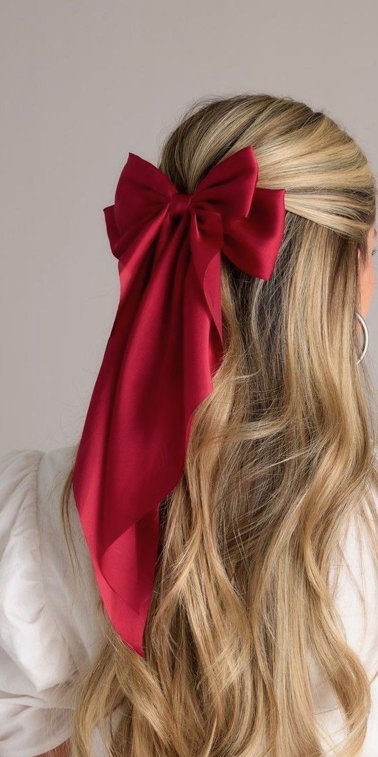 Red bow in blonde hair